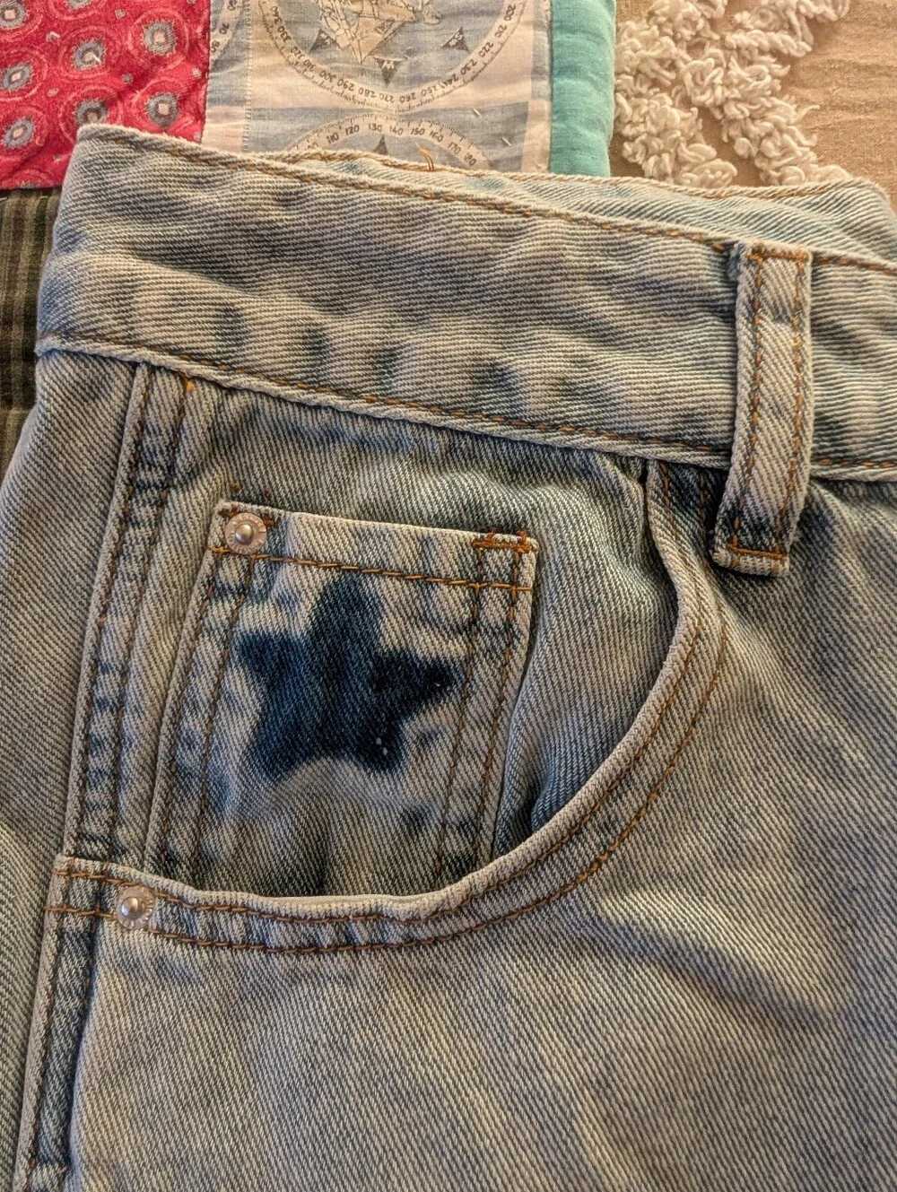 Star jeans, distressed light wash barrel style jeans
